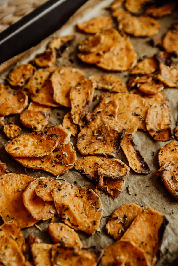 Fresh Sweet Potatoes On A Tray Wallpaper