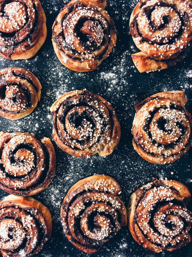 Freshly Baked Cinnamon Rolls With Toppings Wallpaper