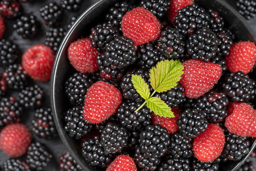 Freshly Picked Ripe Black And Red Raspberries Wallpaper