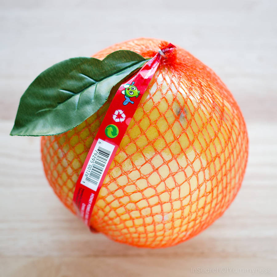 Freshly Wrapped Pomelo Fruit Ready For Transport Wallpaper