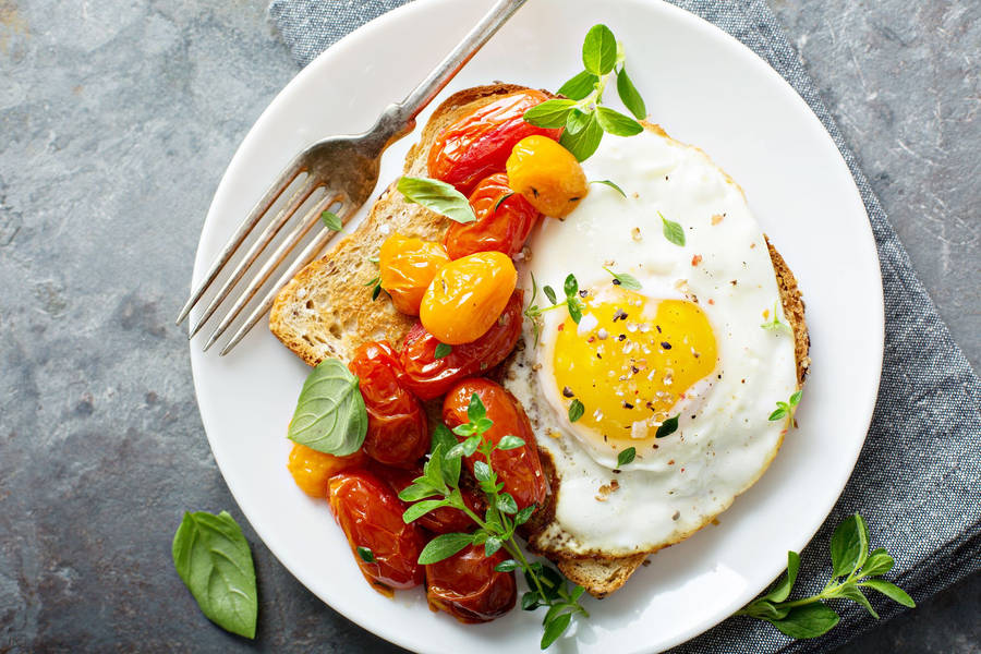 Fried Egg With A Side Of Cherry Tomato Wallpaper