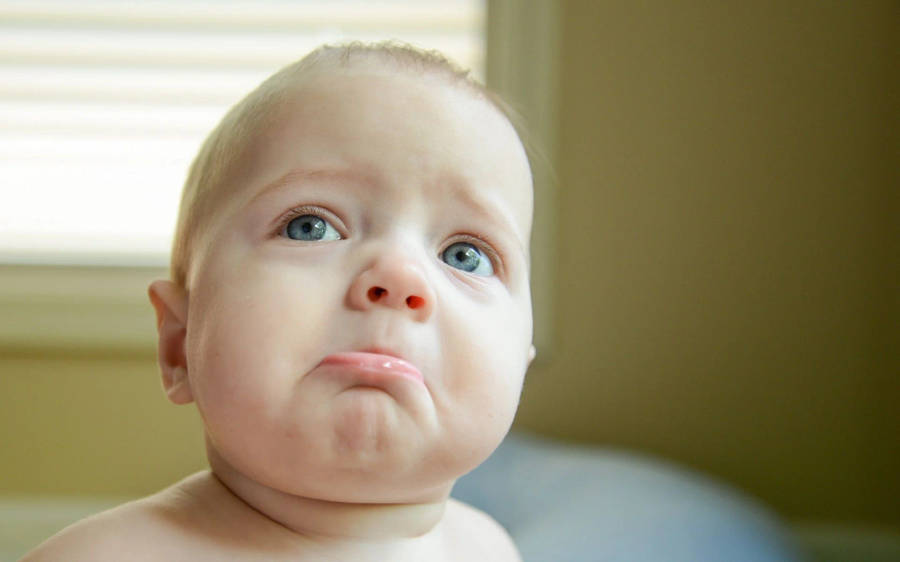 Funny Baby Sad Face Wallpaper