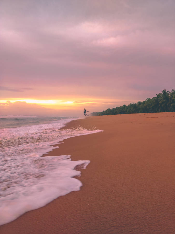 Funny Beach Jumping Wallpaper