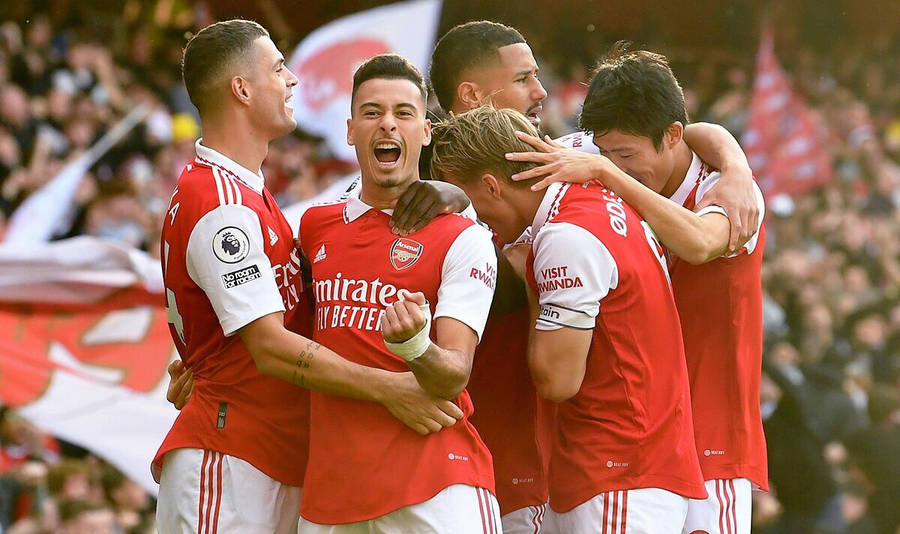 Gabriel Martinelli Celebrating With Team Wallpaper