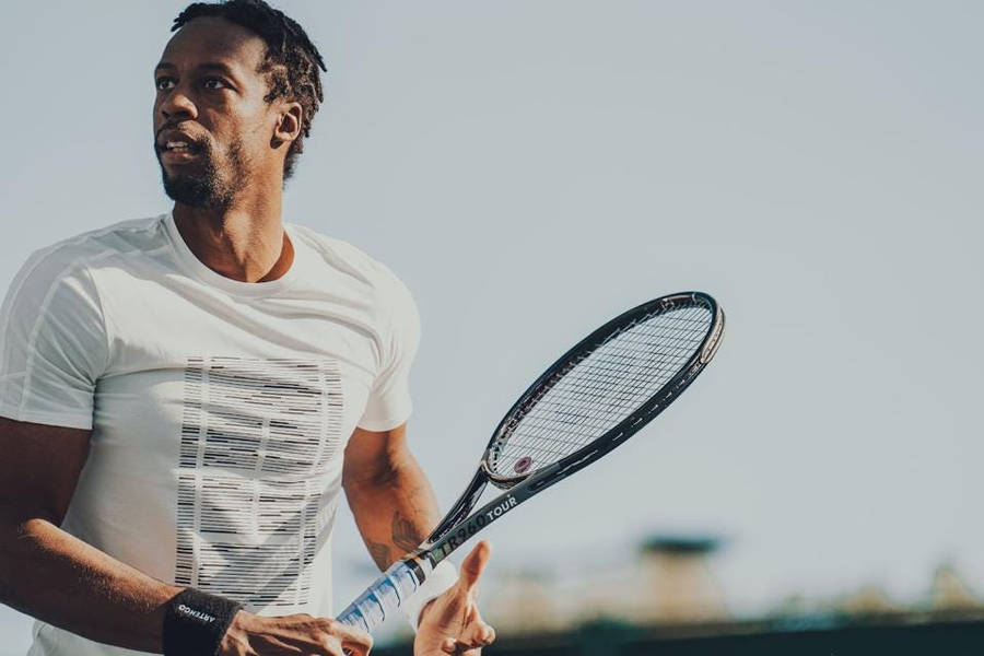 Gael Monfils With Tennis Racket Wallpaper