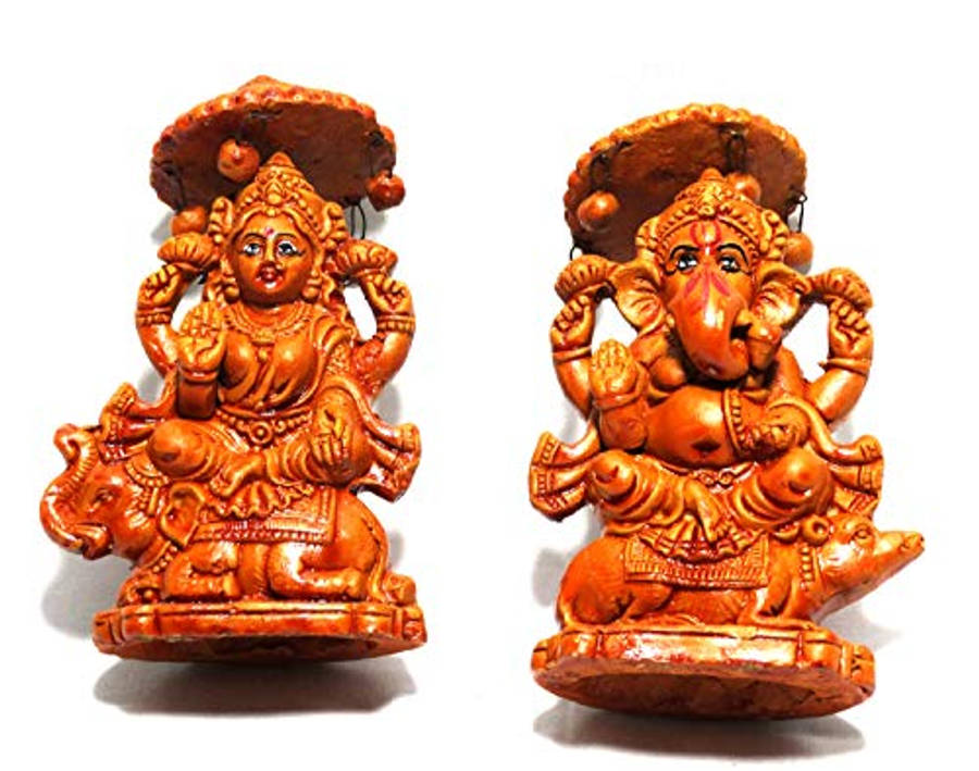 Ganesh Lakshmi Bronze Clay Statues Wallpaper