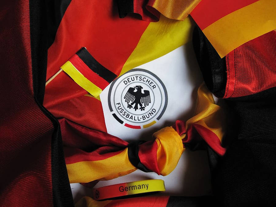 Germany National Football Team Logo With Cheering Paraphernalia Wallpaper