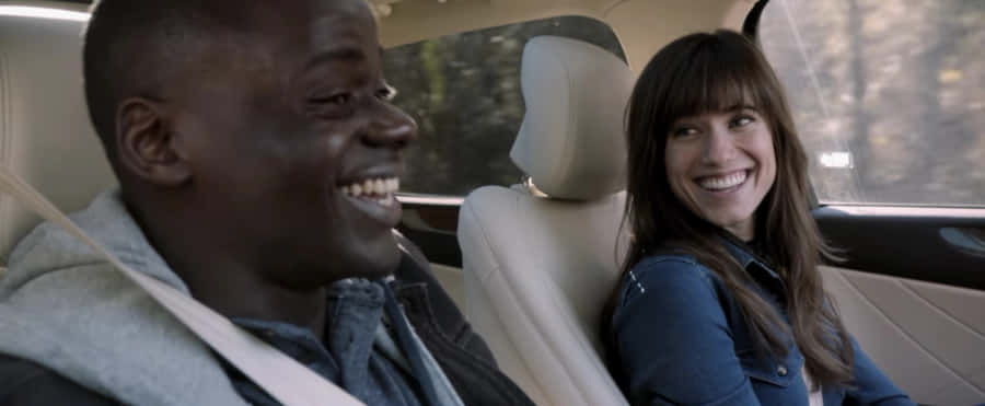 Get Out Movie Car Scene Laughing Couple Wallpaper