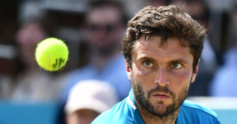 Gilles Simon Focused At Tennis Ball Wallpaper