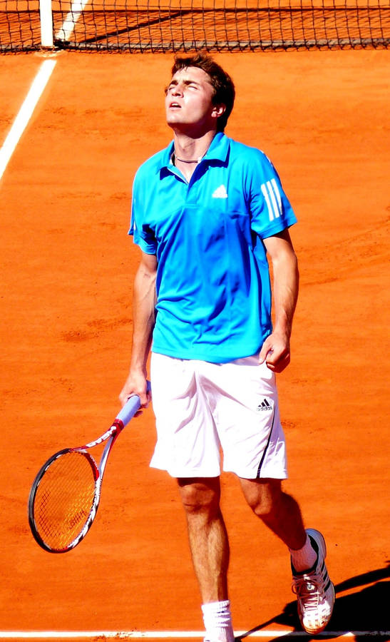 Gilles Simon Reflecting After A Tough Match Wallpaper