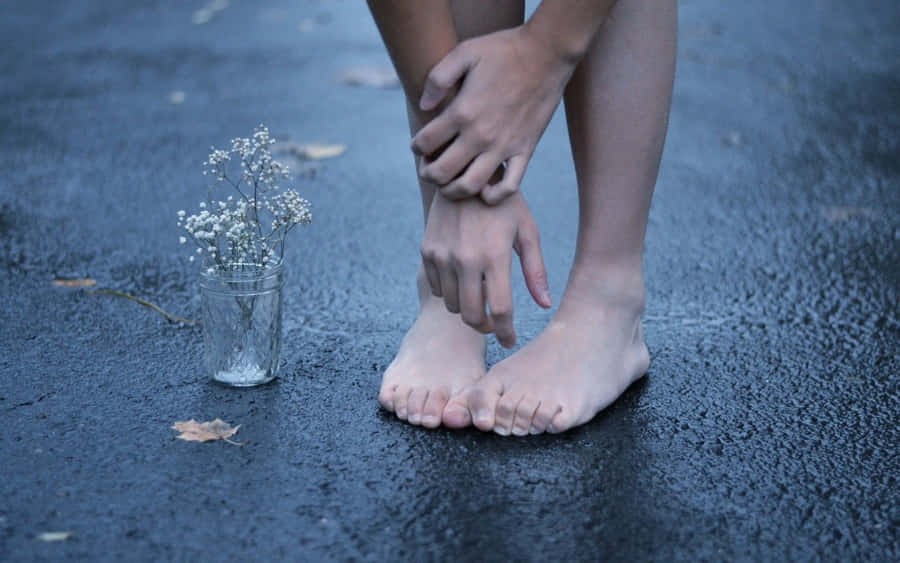 Girl Feet On The Road With Flowers Wallpaper