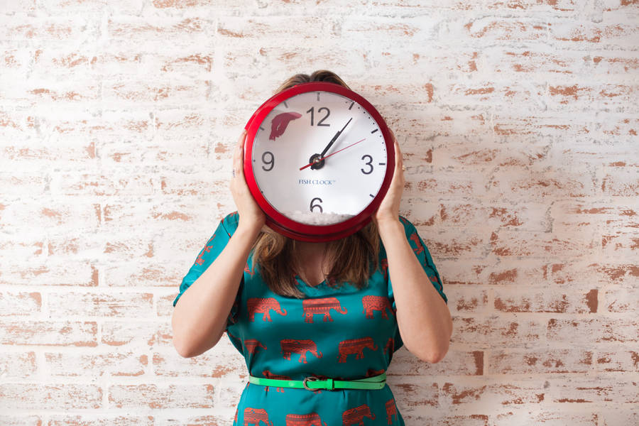 Girl Hiding Behind A Clock Wallpaper