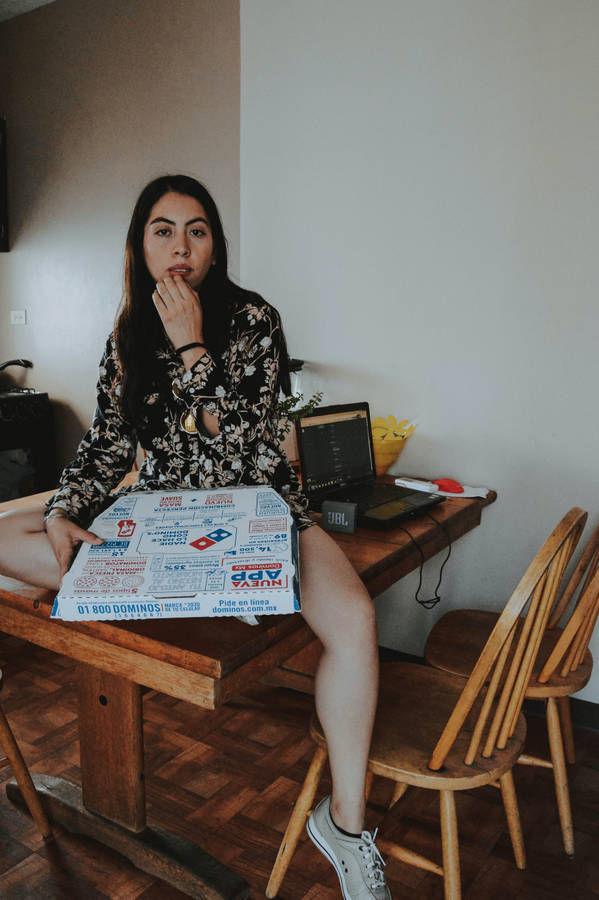 Girl Holding Dominos Pizza Box Wallpaper