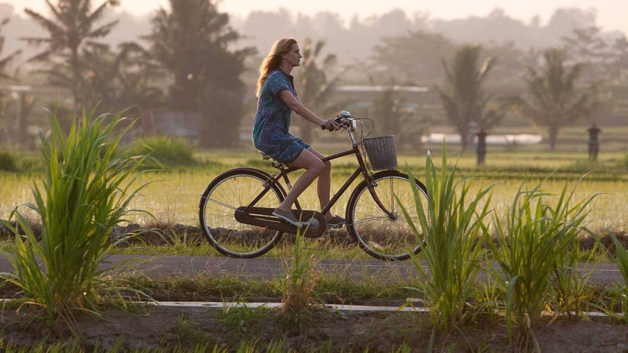 Girl On Bike Ride Wallpaper