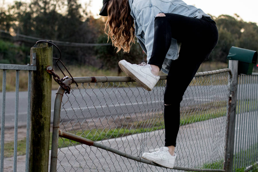 Girl Parkour On Fence Wallpaper