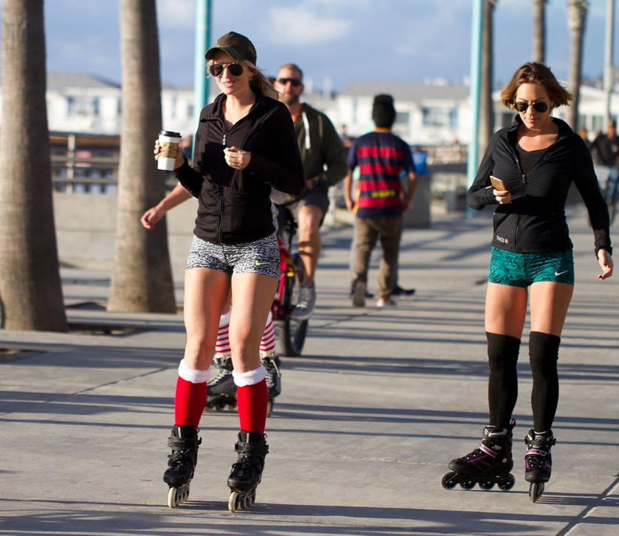 Girls Rollerblading High Socks Wallpaper