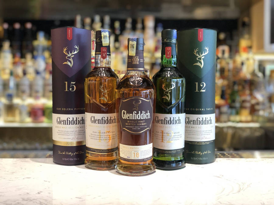 Glenfiddich Flagship Whiskies At Bar Station Wallpaper