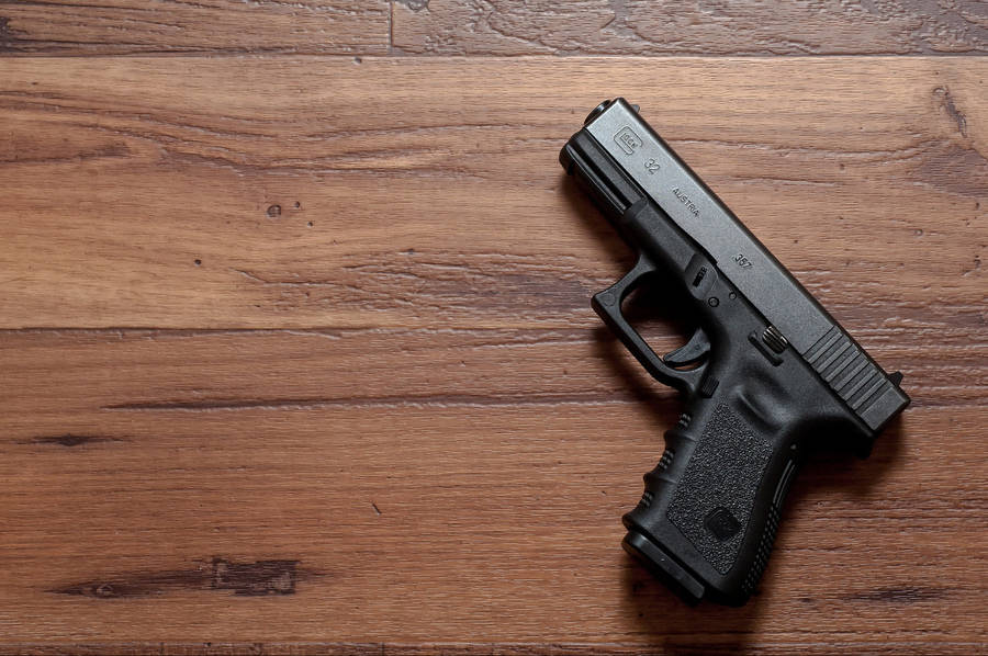 Glock 32 On Wooden Table Wallpaper