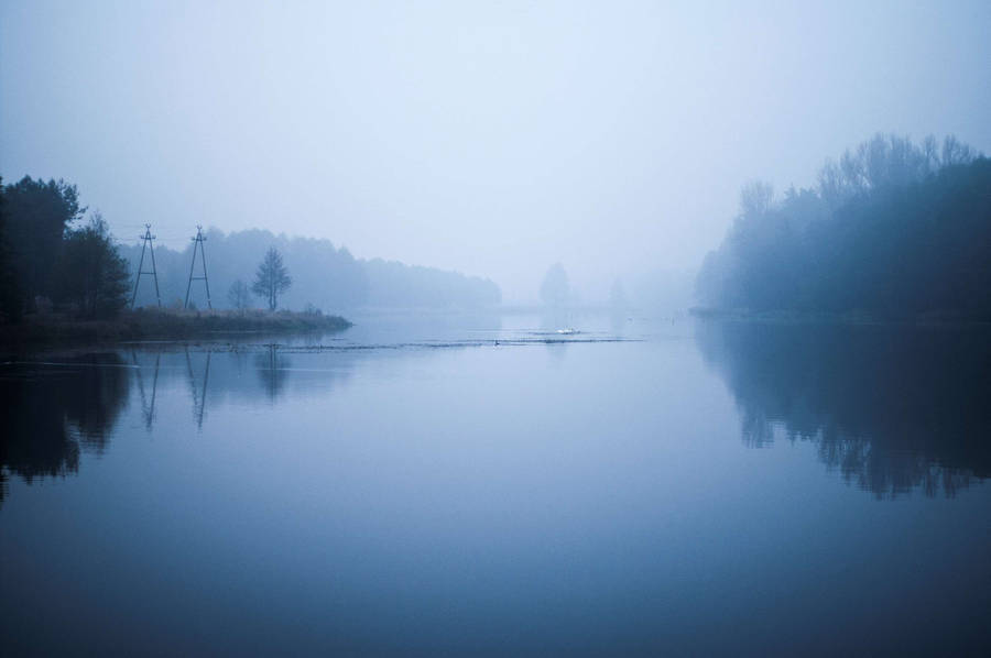 Gloomy And Foggy Forested Riverside Wallpaper