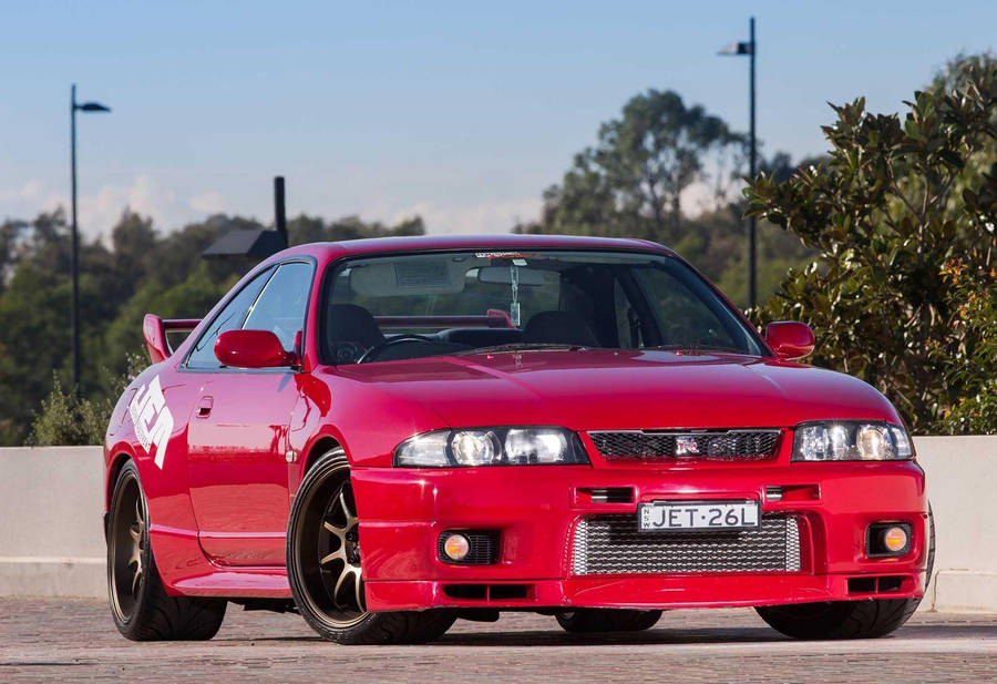 Glossy Red Nissan Skyline Gtr R33 Wallpaper