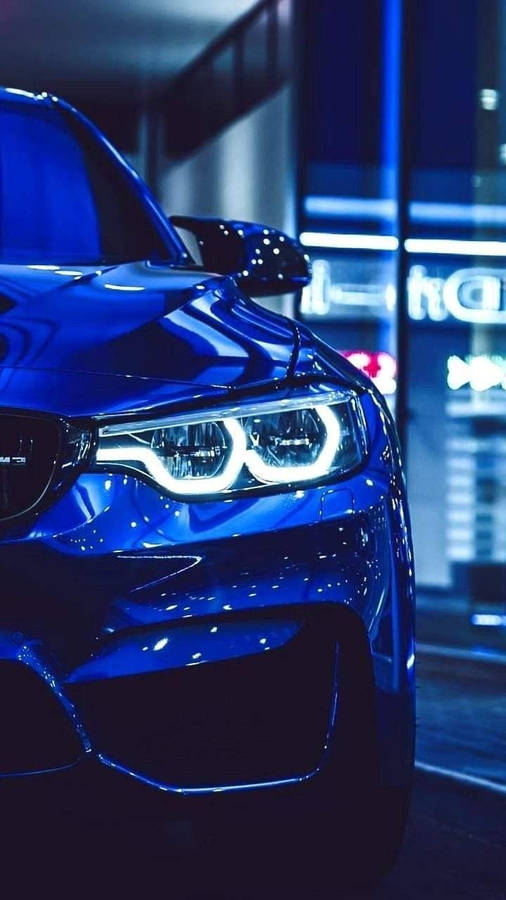 Glowing Headlight Of Blue Bmw Wallpaper