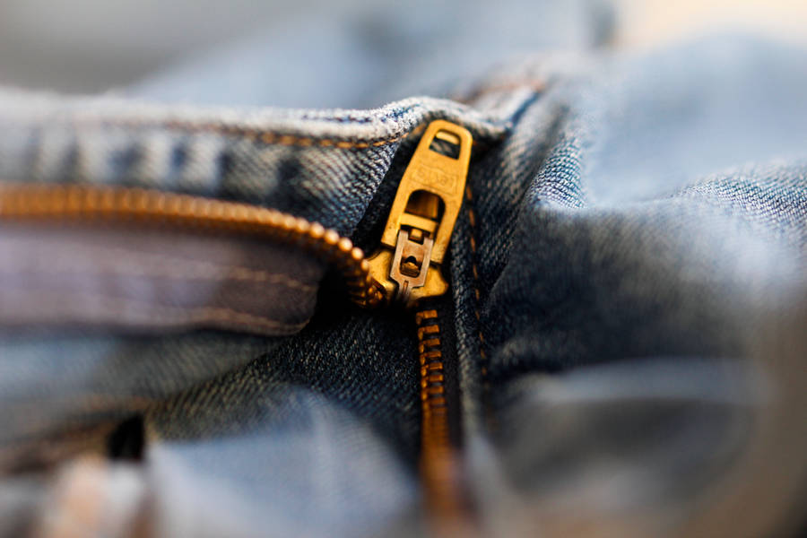 Gold Color Zipper In Denim Jeans Wallpaper