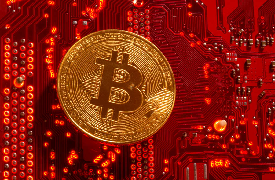 Gold Cryptocurrency Coin On Red Wallpaper