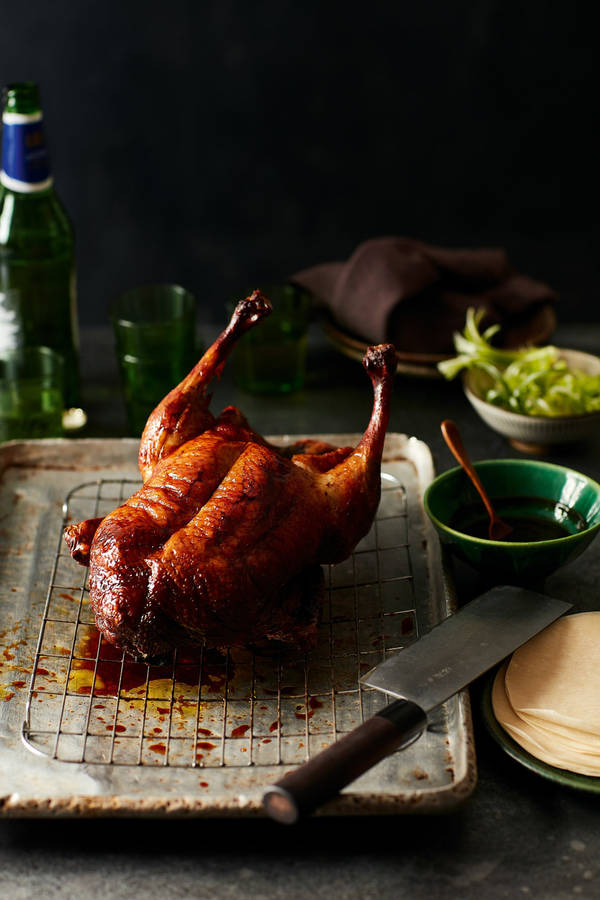 Golden Brown Roasted Peking Duck On Wire Rack Wallpaper