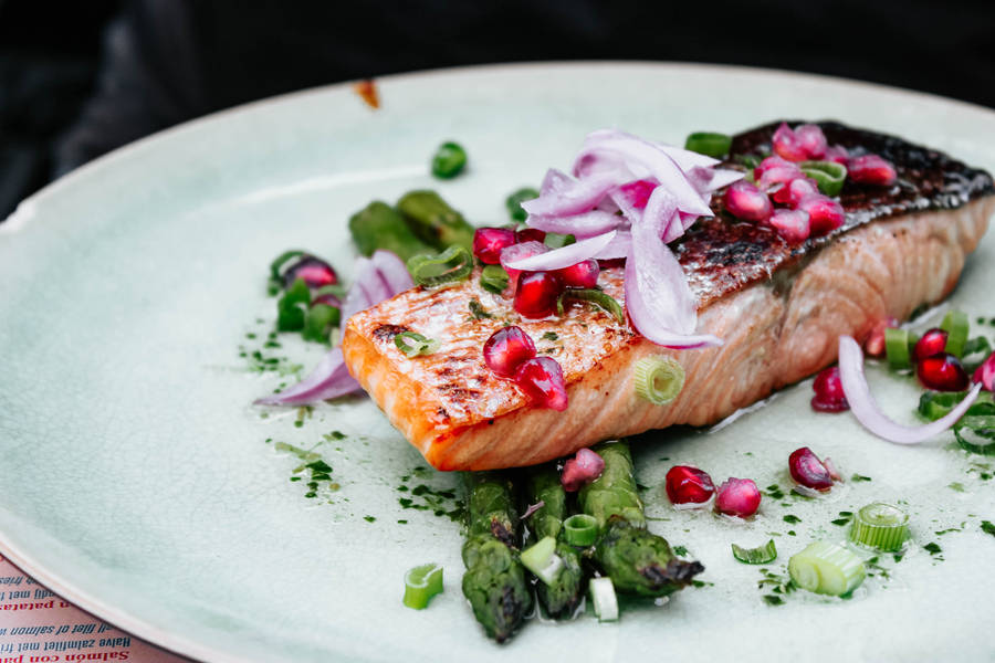 Gourmet-style Salmon Fillet Garnished With Fresh Herbs Wallpaper