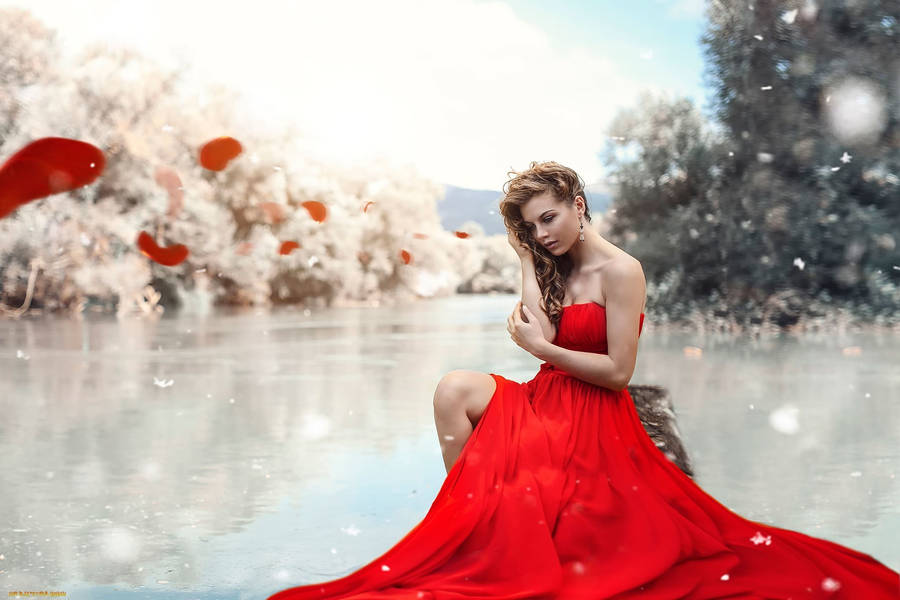 Graceful Fashion Model In Stunning Red Ensemble Wallpaper