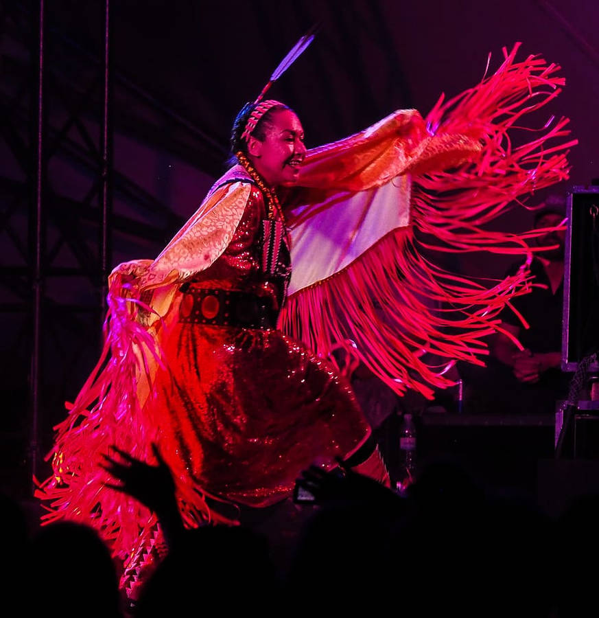 Graceful Navajo Woman Exhibiting A Traditional Dance Pose Wallpaper