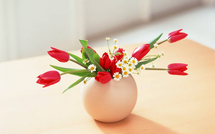 Graceful Red Tulips In Elegant Vase Wallpaper