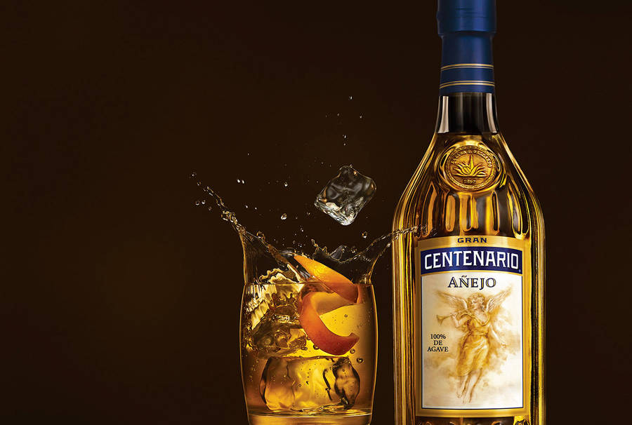 Gran Centenario Tequila Añejo Splashing On Glass Wallpaper