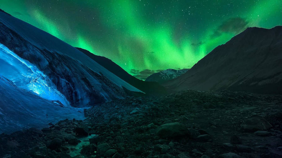 Green Sky Over A Valley Wallpaper