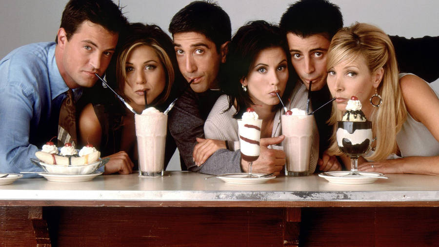 Group Friends Drinking Milkshakes Wallpaper