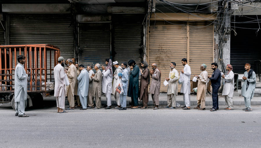 Group Of People In Line Wallpaper