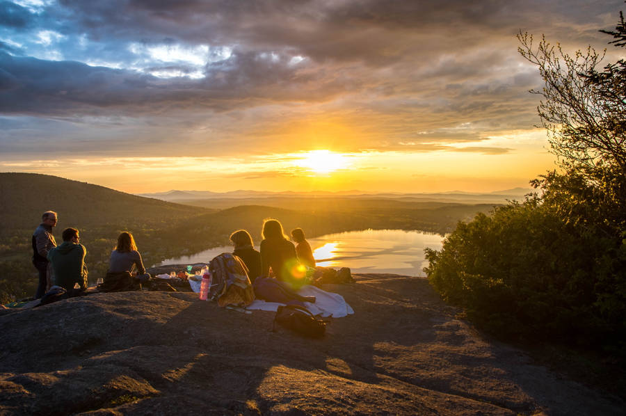 Group Of People Watching The Sunset Wallpaper