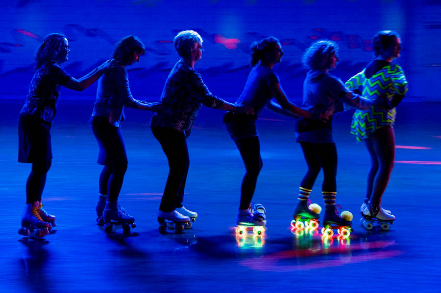 Group Rollerblading Glow In The Dark Wallpaper