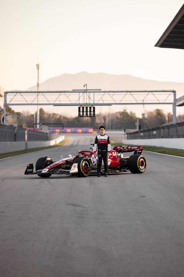 Guanyu Zhou On The Race Track Wallpaper