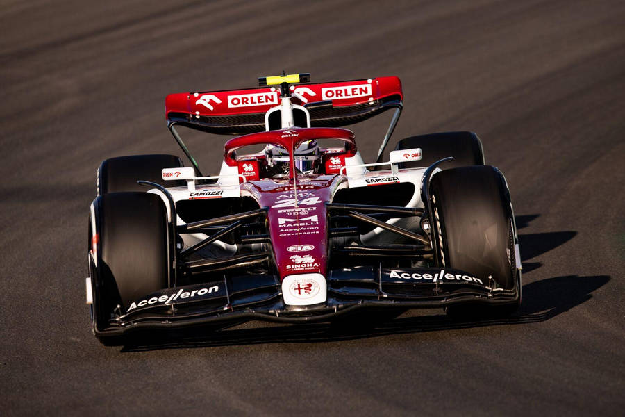 Guanyu Zhou Red And White Race Car Wallpaper