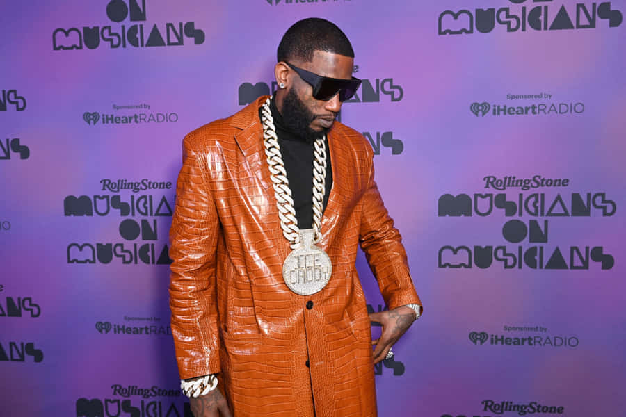 Gucci Mane Orange Suit Event Wallpaper