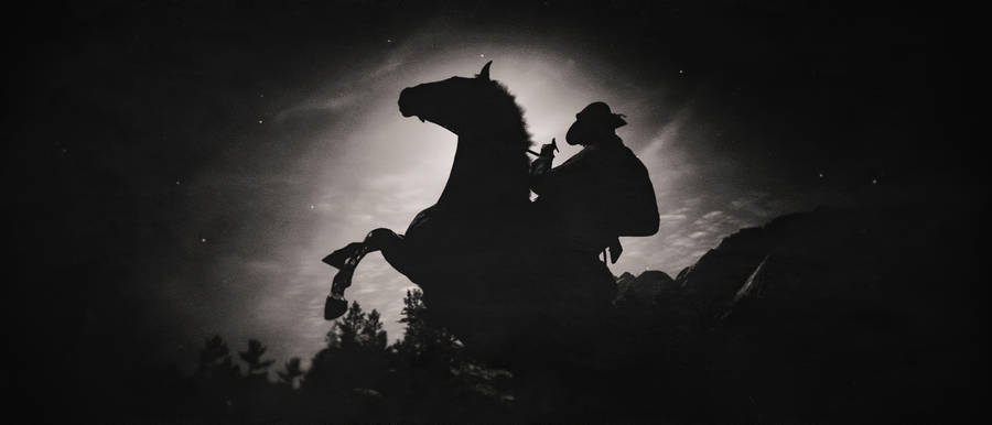 Gunslinger Cowboy Exploring The Wild West In Red Dead Redemption 2 Wallpaper