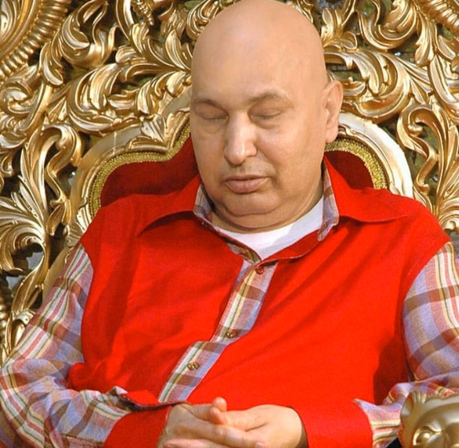 Guru Ji Sleeping In Chair Wallpaper