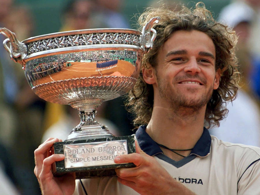 Gustavo Kuerten Holding His Trophy Wallpaper