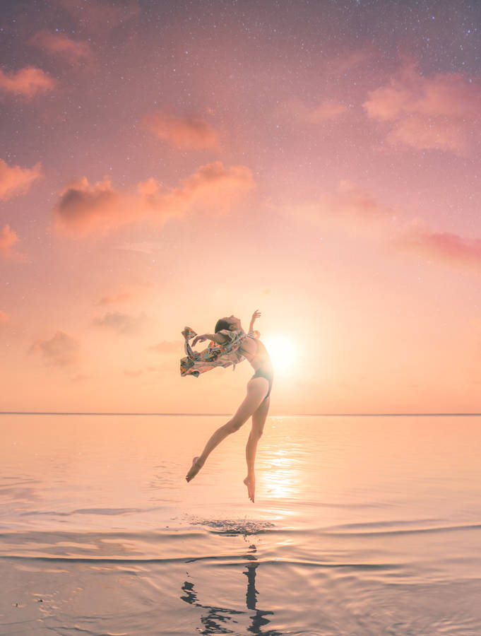 Gymnastics Dance In Ocean Sunset Wallpaper