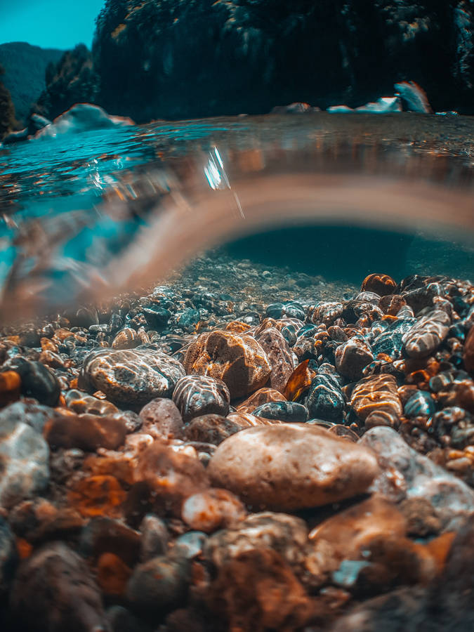 Half Underwater View Of Stones Wallpaper