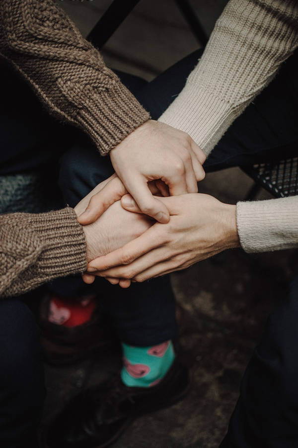 Hand In Hand Couple In Sweater Wallpaper