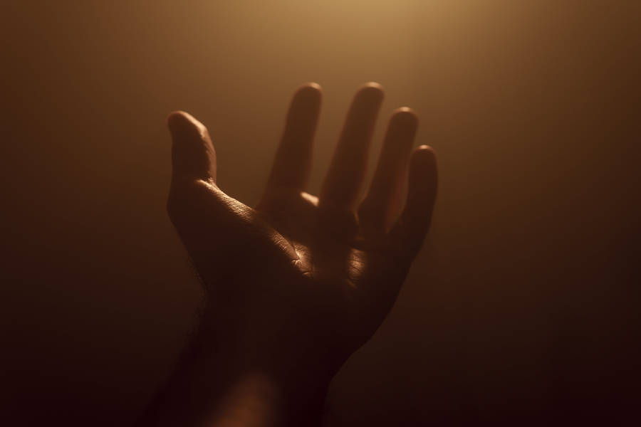 Hand On Dim Light Wallpaper