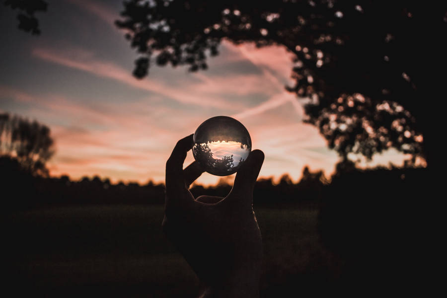 Hand With Transparent Ball Wallpaper