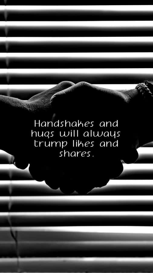 Handshake In Black And White With A Quote Wallpaper